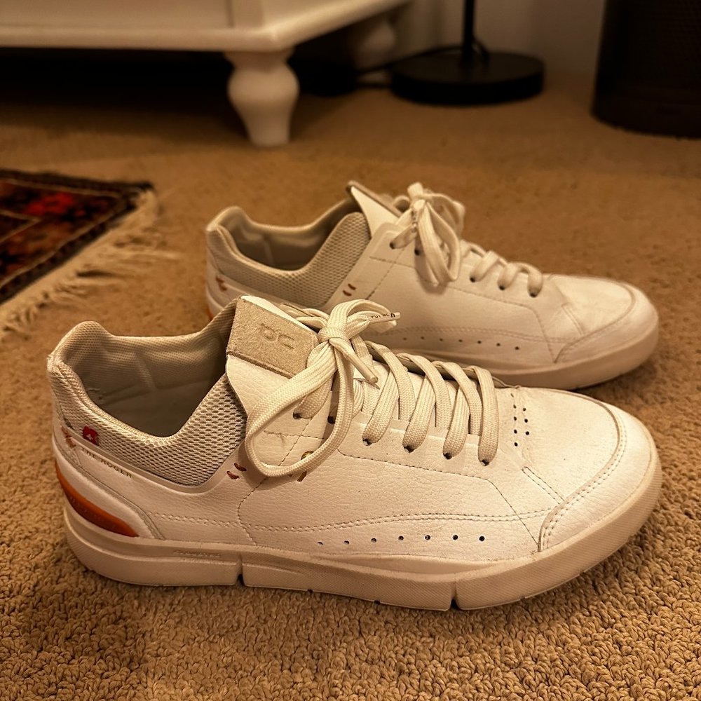 On Running White Sneakers with Orange Accents